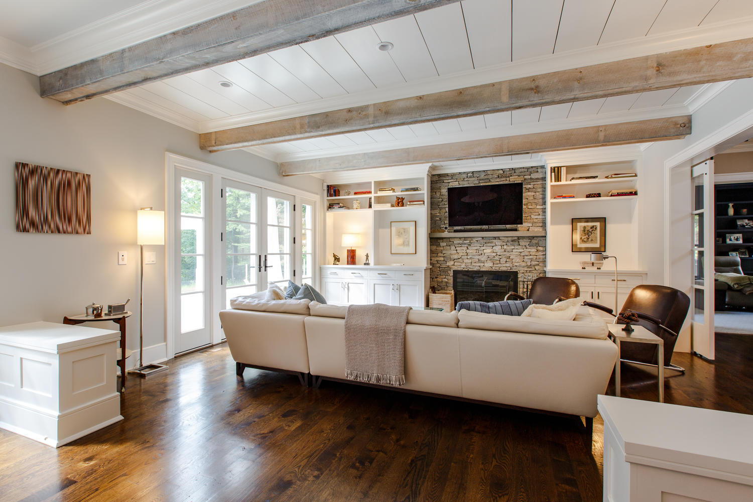 75 Parish Road New Canaan, CT 06840 - Photo 14 of 30 a living room with fireplace furniture and a flat screen tv