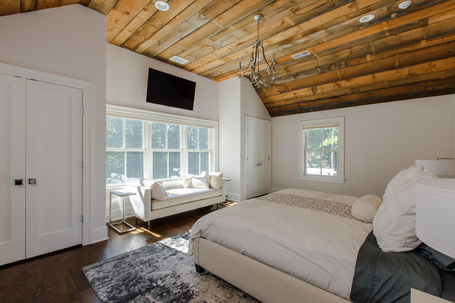 75 Parish Road New Canaan, CT 06840 - Photo 23 of 30 a bedroom with a bed wooden floor and window