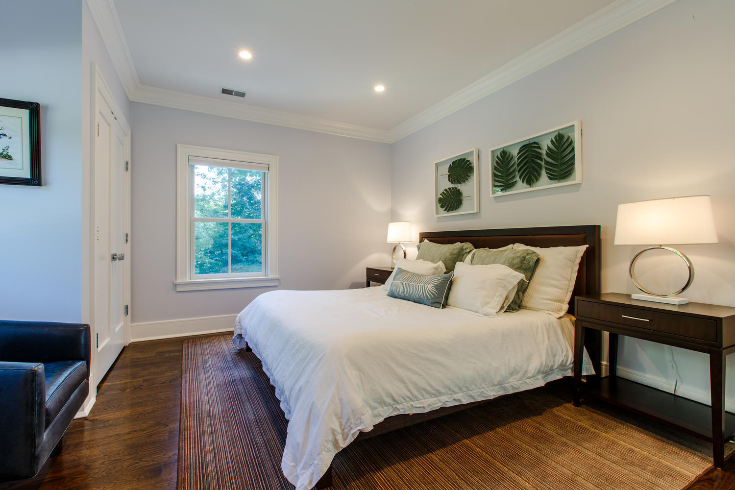 75 Parish Road New Canaan, CT 06840 - Photo 24 of 30 a bedroom with a bed and wooden floor