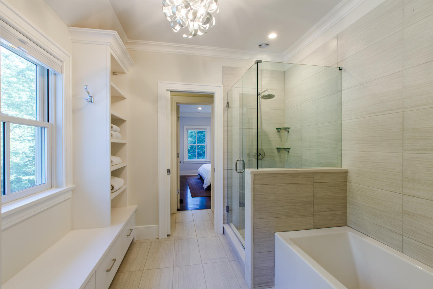 75 Parish Road New Canaan, CT 06840 - Photo 25 of 30 a bathroom with a tub a sink and a shower