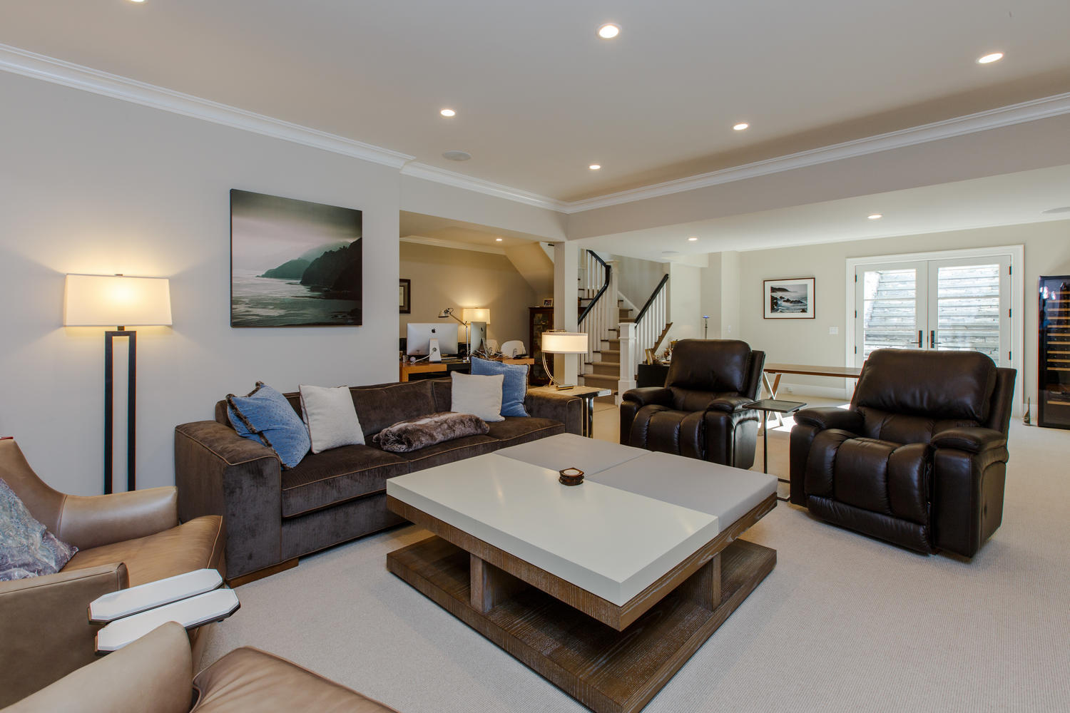 75 Parish Road New Canaan, CT 06840 - Photo 27 of 30 a living room with furniture a lamp and a flat screen tv