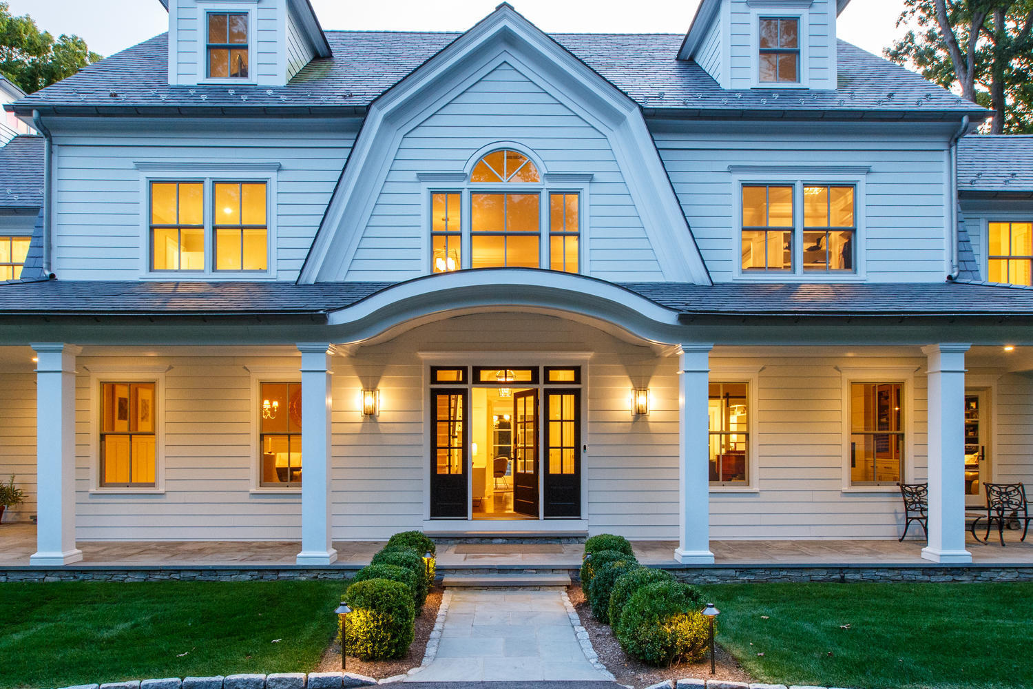 75 Parish Road New Canaan, CT 06840 - Photo 5 of 30 a front view of a house with a yard