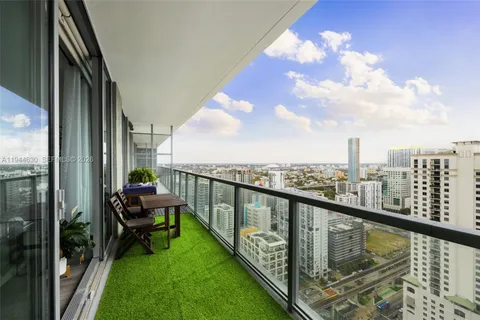 a view of a balcony with chairs