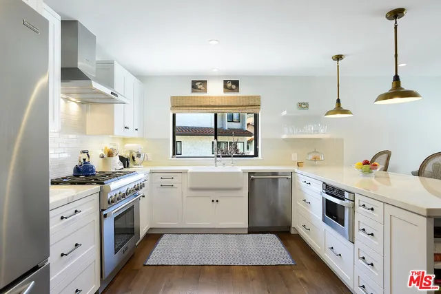 a view of a livingroom with furniture and a table