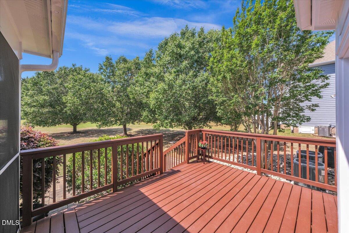 2908 Oak Bridge Drive Raleigh, NC 27610 - Photo 38 of 47 a view of balcony with wooden floor and fence