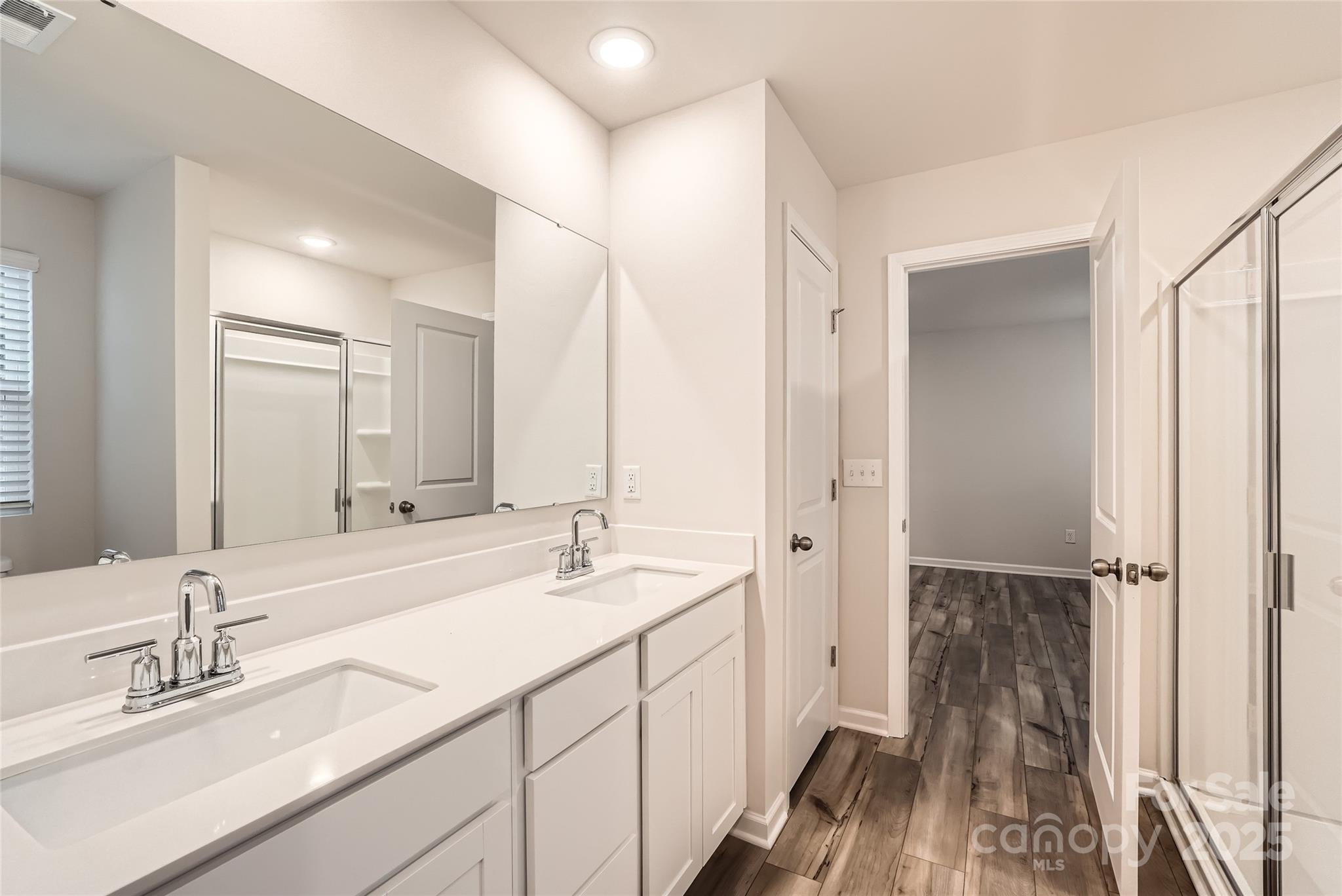 1608 Cannonball Lane Bessemer City, NC 28016 - Photo 8 of 13 a bathroom with a double vanity sink mirror and double