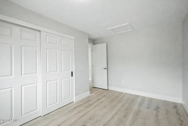 an empty room with wooden floor