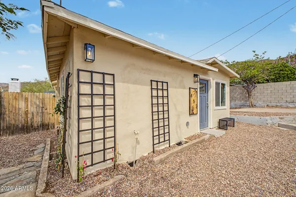 a front view of a house with a outdoor space