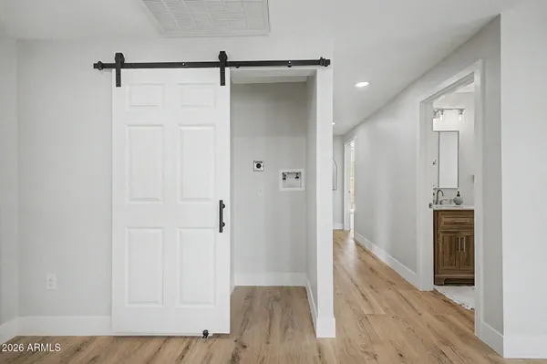 a view of kitchen with wooden floor and window