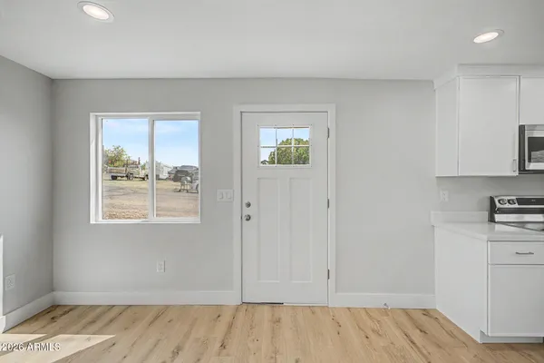a view of a kitchen with microwave and stove
