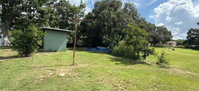 a living room with furniture fireplace and a large window