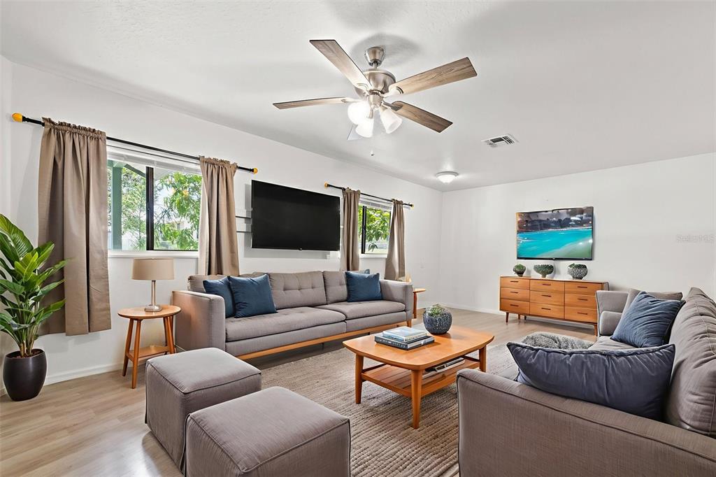 304 Shepard Avenue Dundee, FL 33838 - Photo 22 of 62 a living room with furniture and a flat screen tv