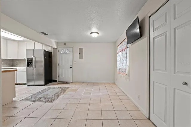 a view of room with window and ceiling fan