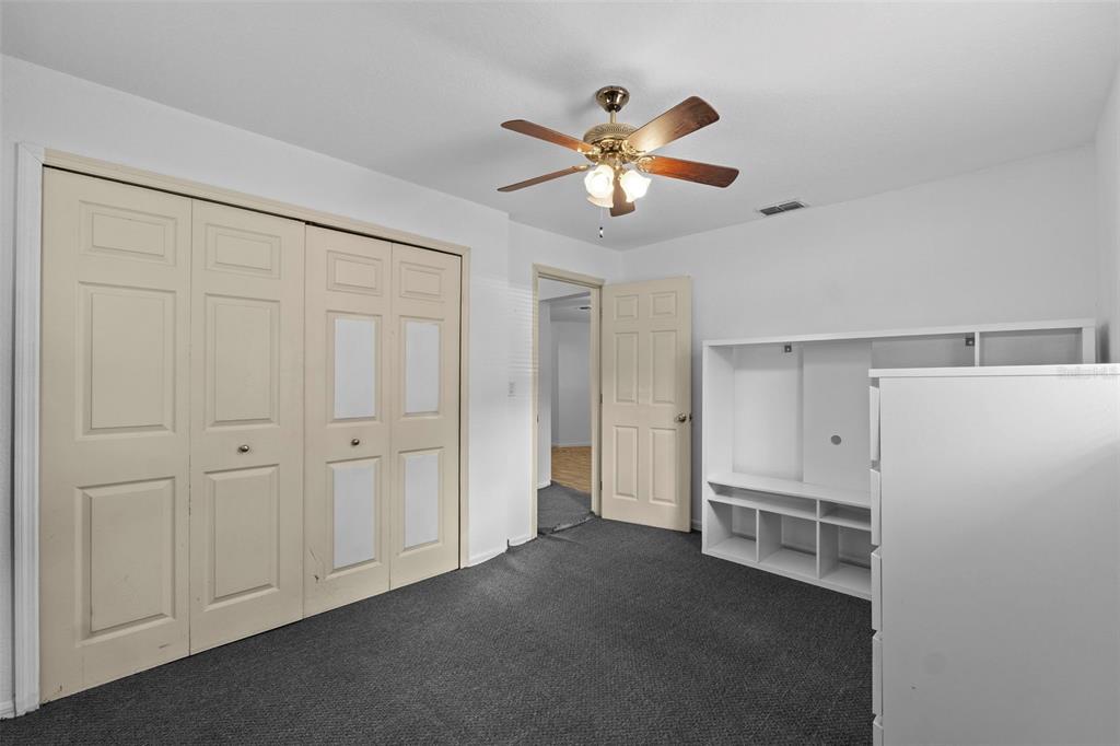 304 Shepard Avenue Dundee, FL 33838 - Photo 39 of 62 a view of a livingroom with a chandelier fan