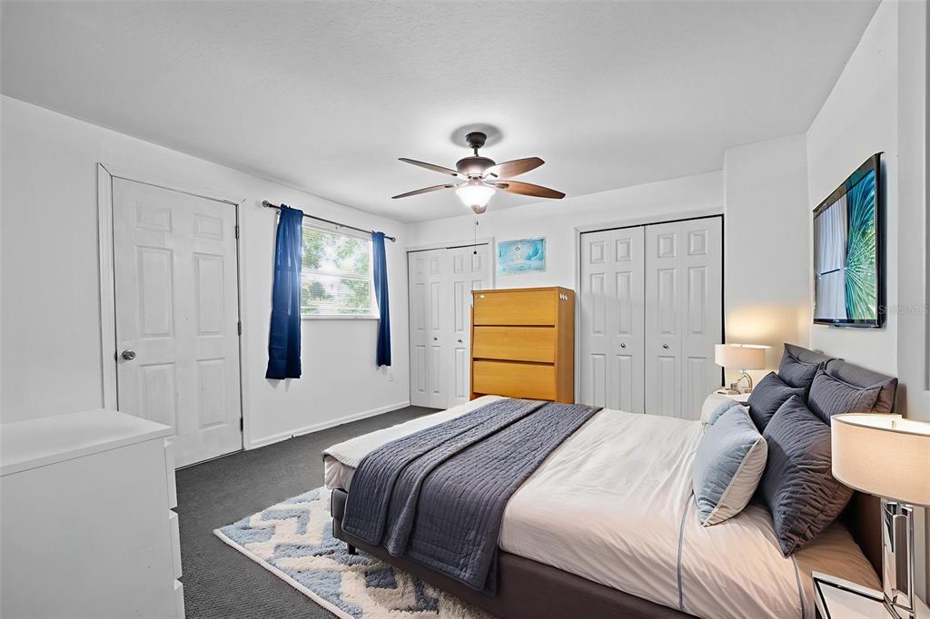 304 Shepard Avenue Dundee, FL 33838 - Photo 43 of 62 a bedroom with a bed dresser and a window