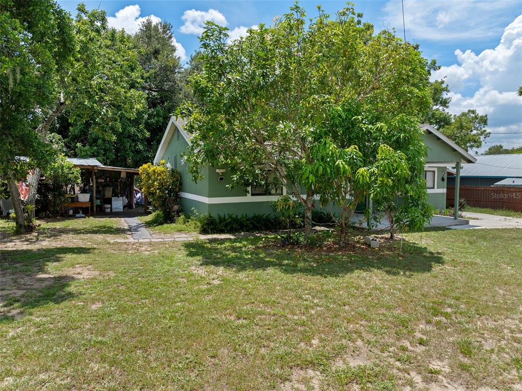 304 Shepard Avenue Dundee, FL 33838 - Photo 47 of 62 a view of a backyard with a garden