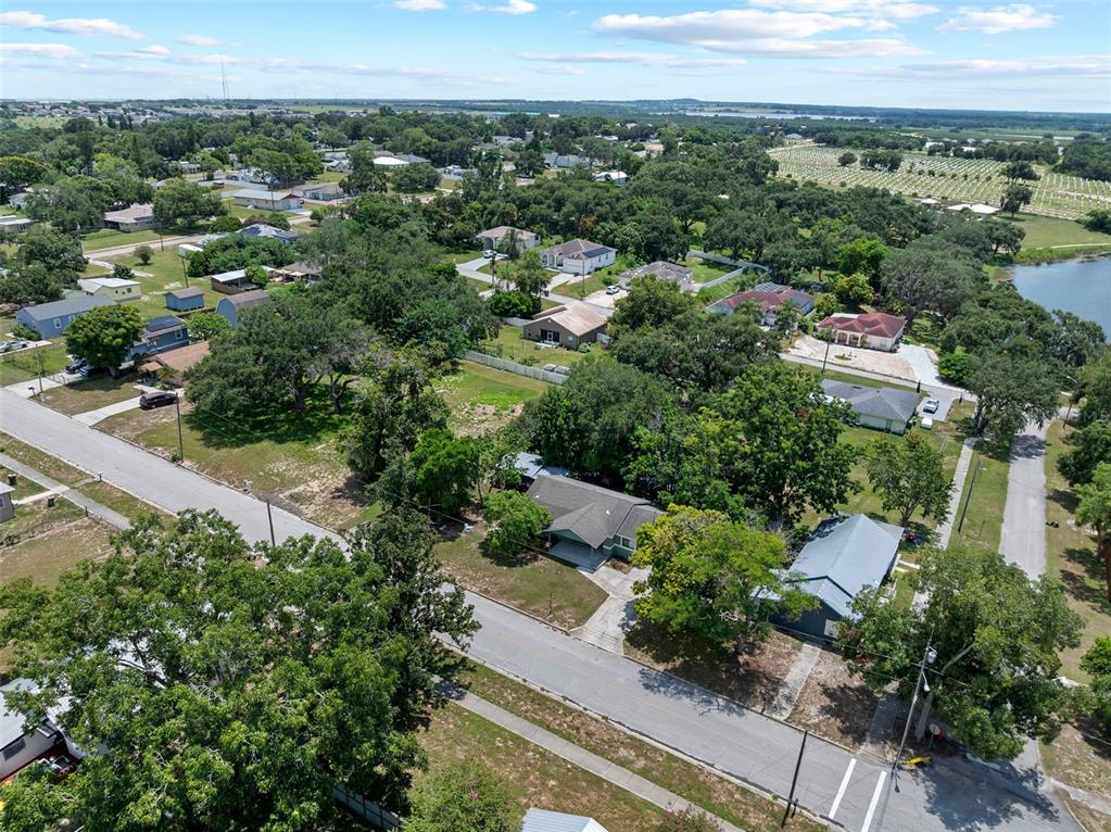 304 Shepard Avenue Dundee, FL 33838 - Photo 52 of 62 an aerial view of a city with lots of residential buildings