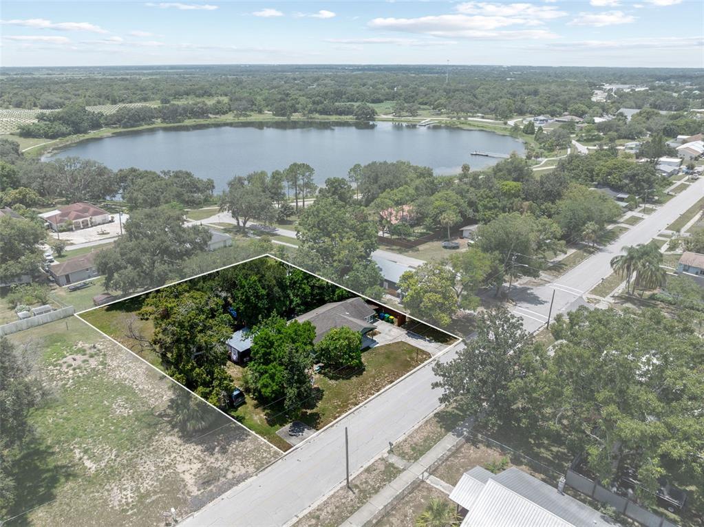 304 Shepard Avenue Dundee, FL 33838 - Photo 54 of 62 a view of a lake with outdoor space