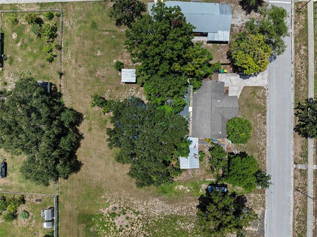 304 Shepard Avenue Dundee, FL 33838 - Photo 56 of 62 an aerial view of a house with a yard