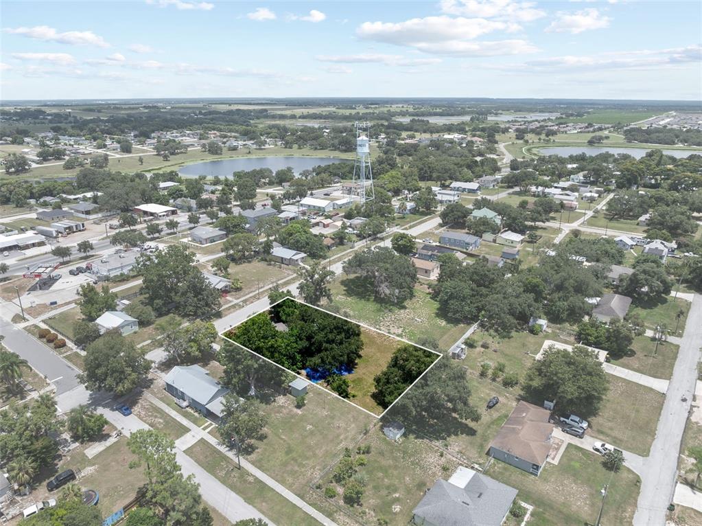 304 Shepard Avenue Dundee, FL 33838 - Photo 58 of 62 an aerial view of residential building with parking space