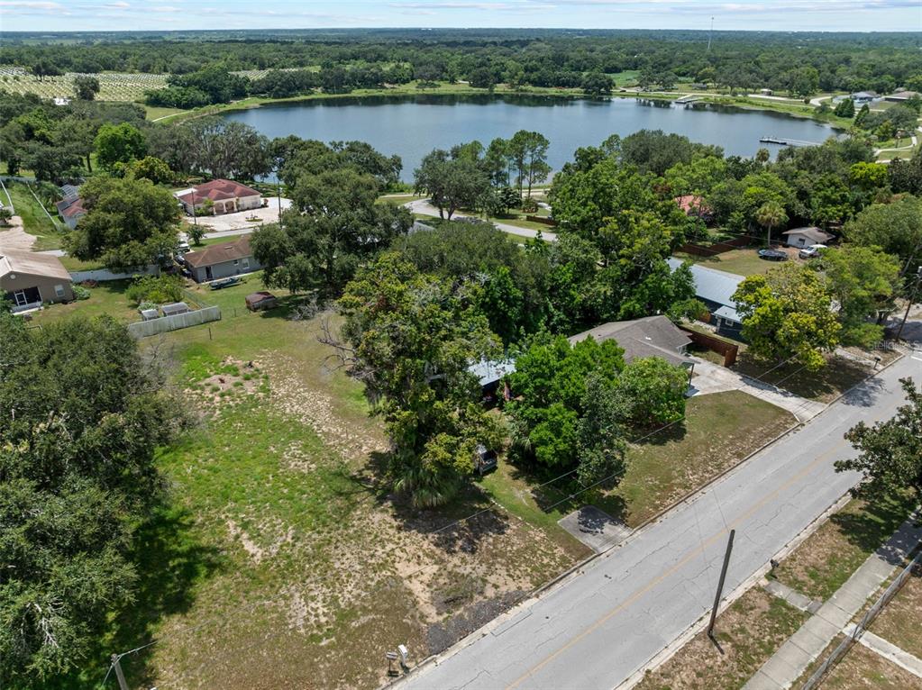 304 Shepard Avenue Dundee, FL 33838 - Photo 62 of 62 an aerial view of a residential houses with outdoor space and lake view