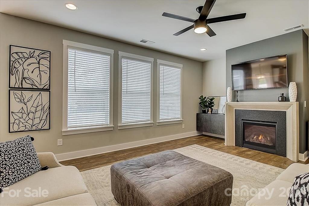 1217 Therns Ferry Drive Fort Mill, SC 29708 - Photo 12 of 47 a spacious bedroom with a bed and a fireplace