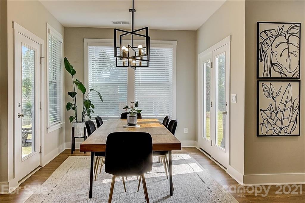 1217 Therns Ferry Drive Fort Mill, SC 29708 - Photo 20 of 47 a view of a livingroom with furniture wooden floor a chandelier
