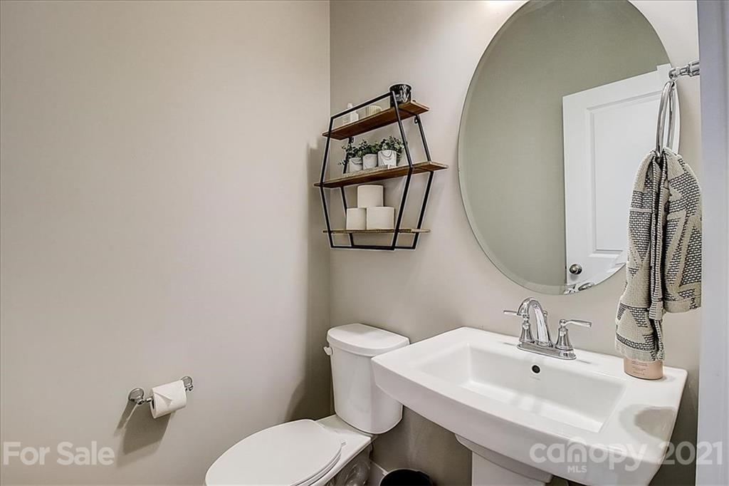 1217 Therns Ferry Drive Fort Mill, SC 29708 - Photo 22 of 47 a bathroom with a toilet a sink and mirror
