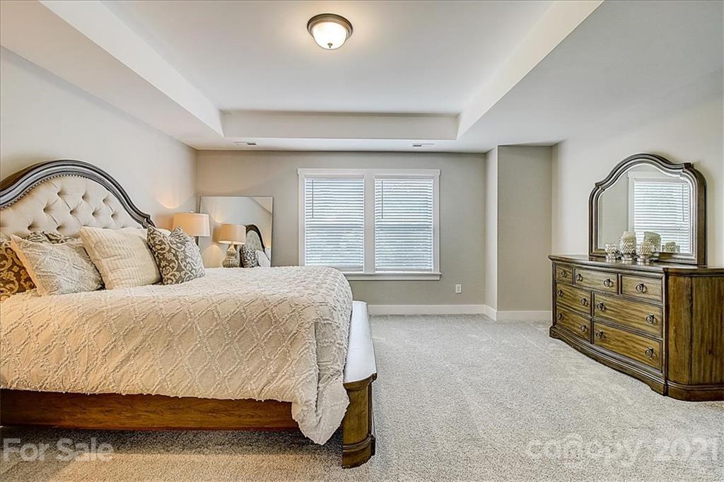 1217 Therns Ferry Drive Fort Mill, SC 29708 - Photo 28 of 47 a spacious bedroom with a bed and dresser