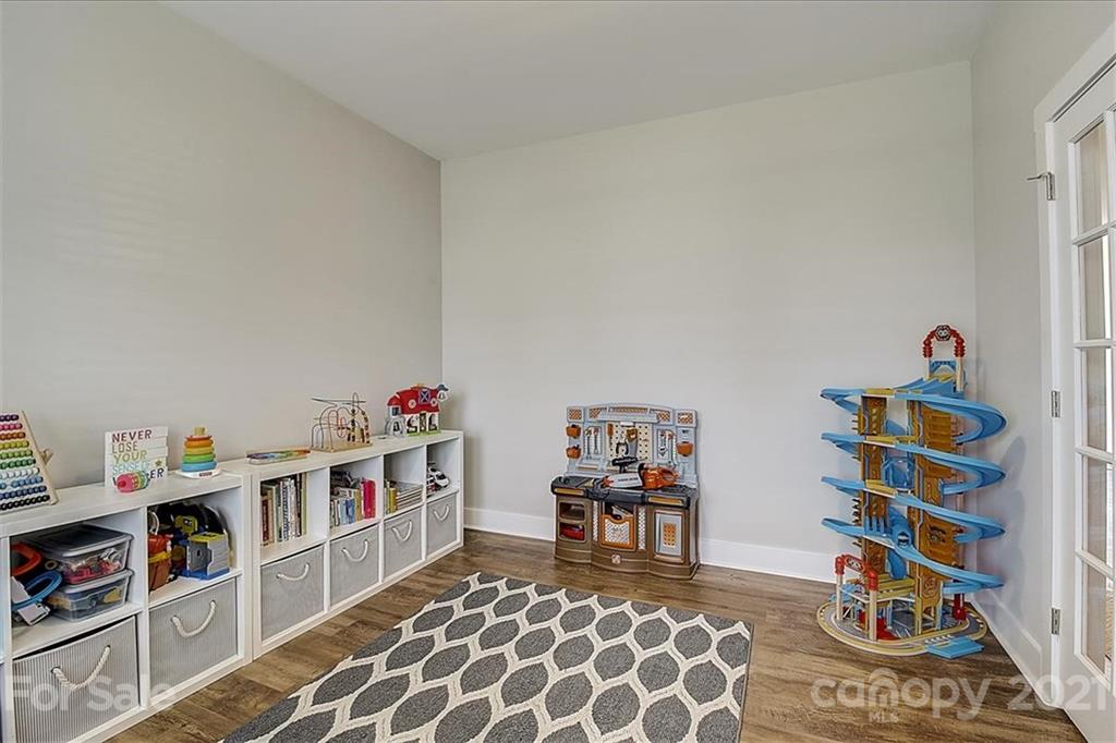 1217 Therns Ferry Drive Fort Mill, SC 29708 - Photo 6 of 47 a room with furniture and a book shelf