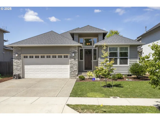 a front view of a house with a yard