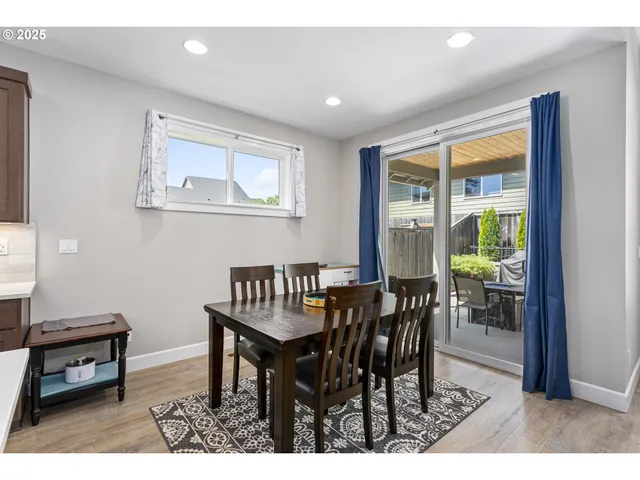 a view of a dining room with furniture window and outside view