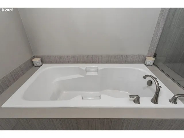 a bath tub sitting in a bathroom