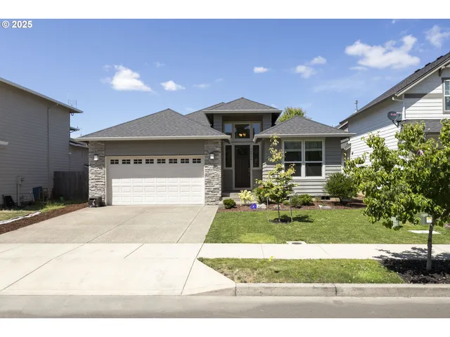 a front view of a house with garden
