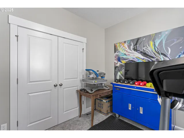 a kitchen with a refrigerator and a stove