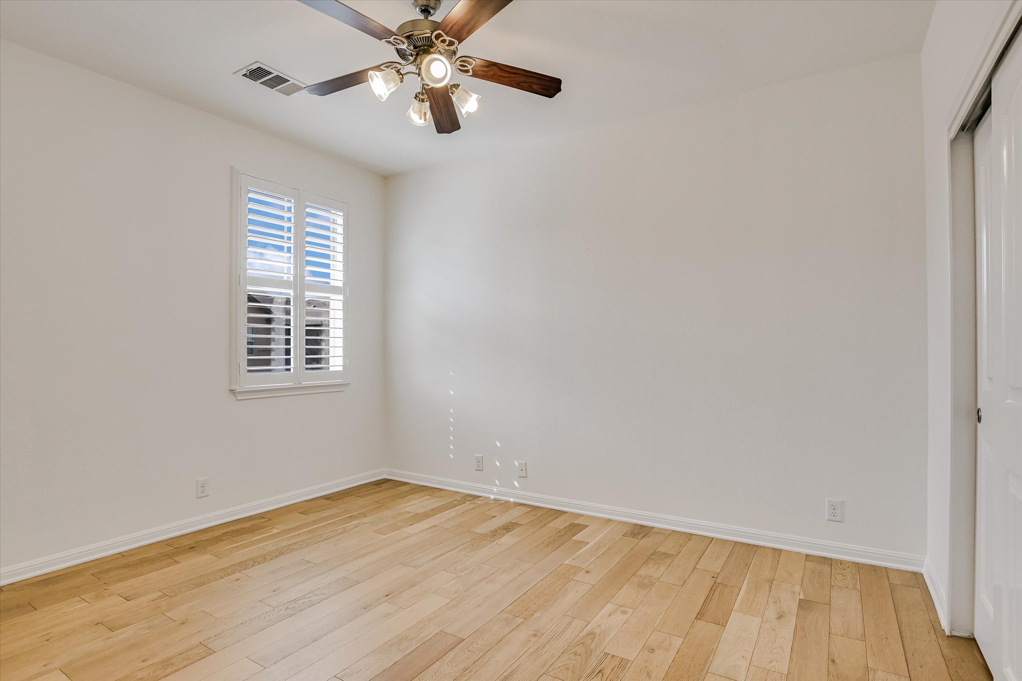 14001 Avery Ranch Boulevard, Unit 1601 Austin, TX 78717 - Photo 12 of 25 3rd Unfurnished room with light wood finished floors, plantation shutters and ceiling fan