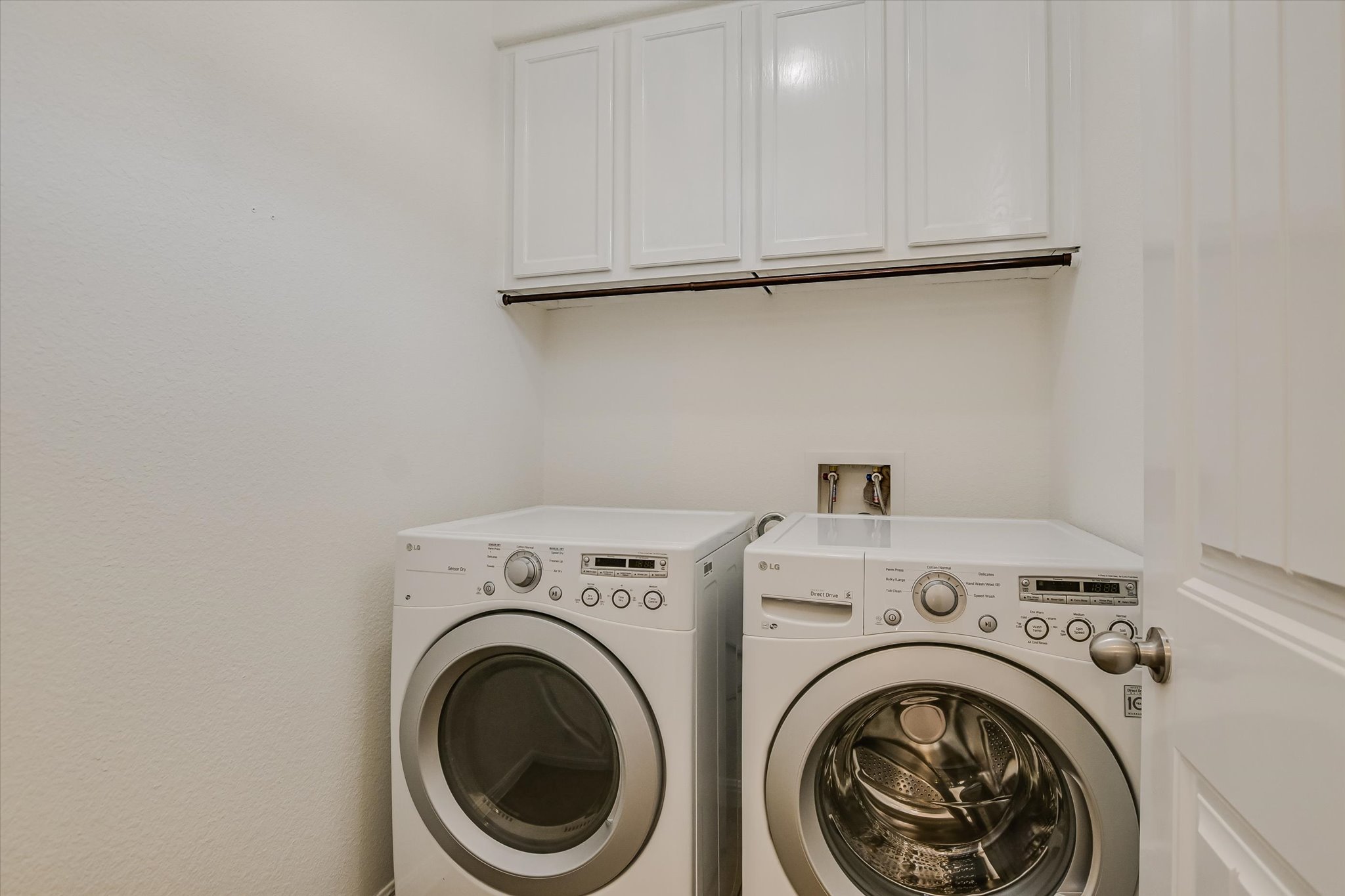 14001 Avery Ranch Boulevard, Unit 1601 Austin, TX 78717 - Photo 14 of 25 Laundry area with washer and dryer that convey and plenty of cabinet storage.