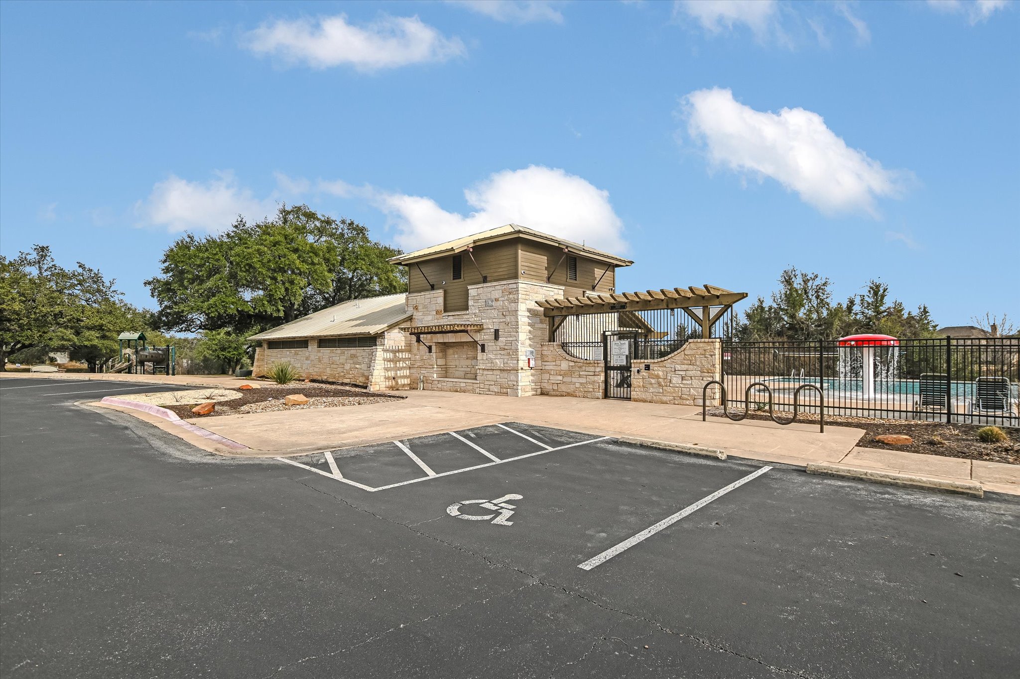 14001 Avery Ranch Boulevard, Unit 1601 Austin, TX 78717 - Photo 23 of 25 Uncovered parking lot with a community pool