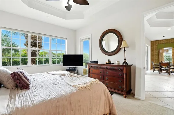 a view of a dining room with furniture and a chandelier