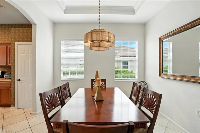 a dining room with furniture window and outside view