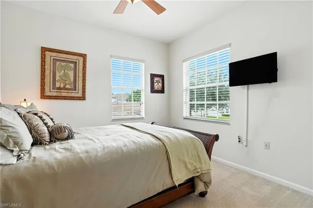 an aerial view of residential houses with outdoor space and river