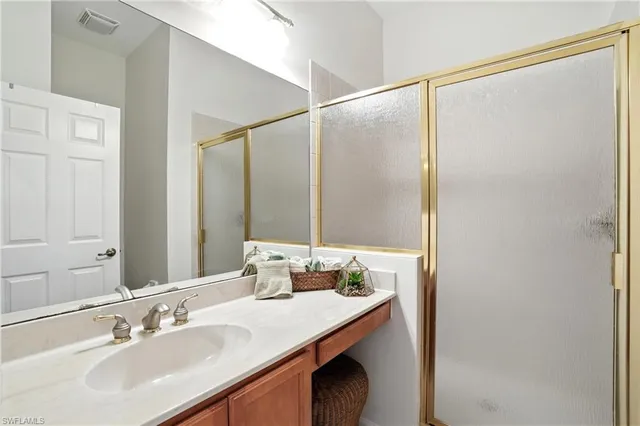 an aerial view of a city with lots of residential buildings lake and ocean view