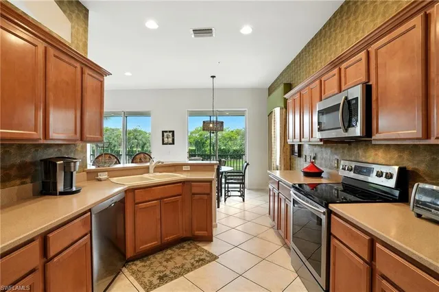 a living room with furniture two window and a fireplace