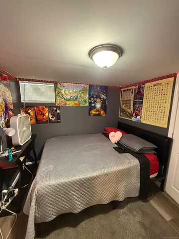 a large white kitchen with sink and stainless steel appliances