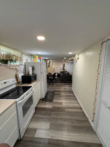 a bathroom with a toilet and a shower curtain