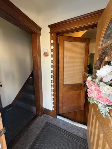 a spacious bedroom with a bed and a window
