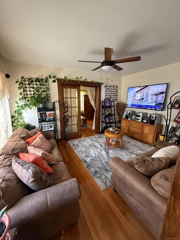 a living room with furniture and a flat screen tv