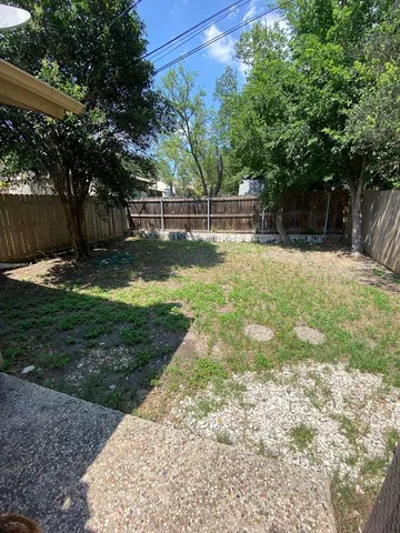 a view of backyard with green space
