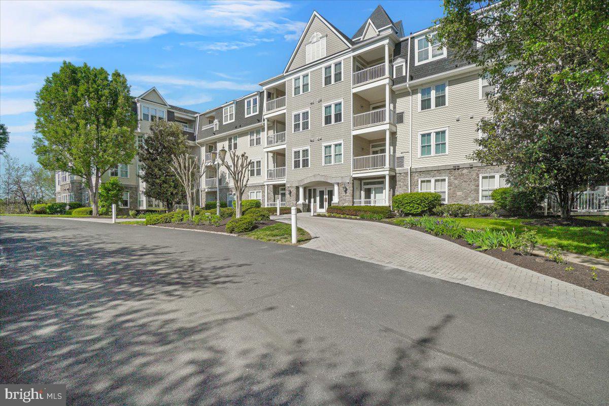 2500 Waterside Drive, Unit 306 Frederick, MD 21701 - Photo 32 of 50 a front view of a building with street view