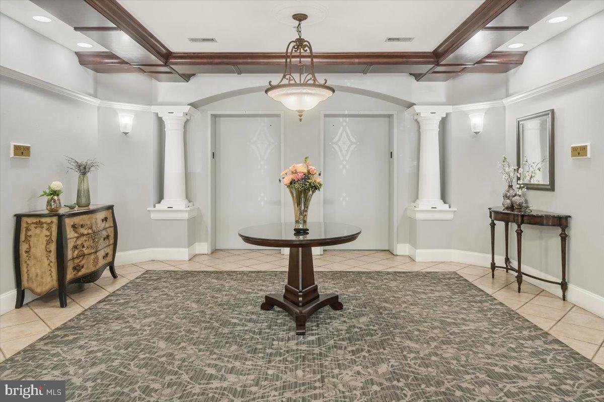 2500 Waterside Drive, Unit 306 Frederick, MD 21701 - Photo 4 of 50 a view of a livingroom with furniture and a chandelier
